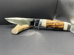 #690 - Nolen Clip Point.  Blade length 6 1/4, overall 10 3/4.  Made with 440c.  The handle is burl ironwood with white corion spacers and a nickel silver guard and butt cap.  $400.00