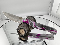 #711 - Nolen neck knife.  Blade 3 1/2, overall 7 1/2.  Made with 440c.  Purple and white acrylic handle.  $110.00